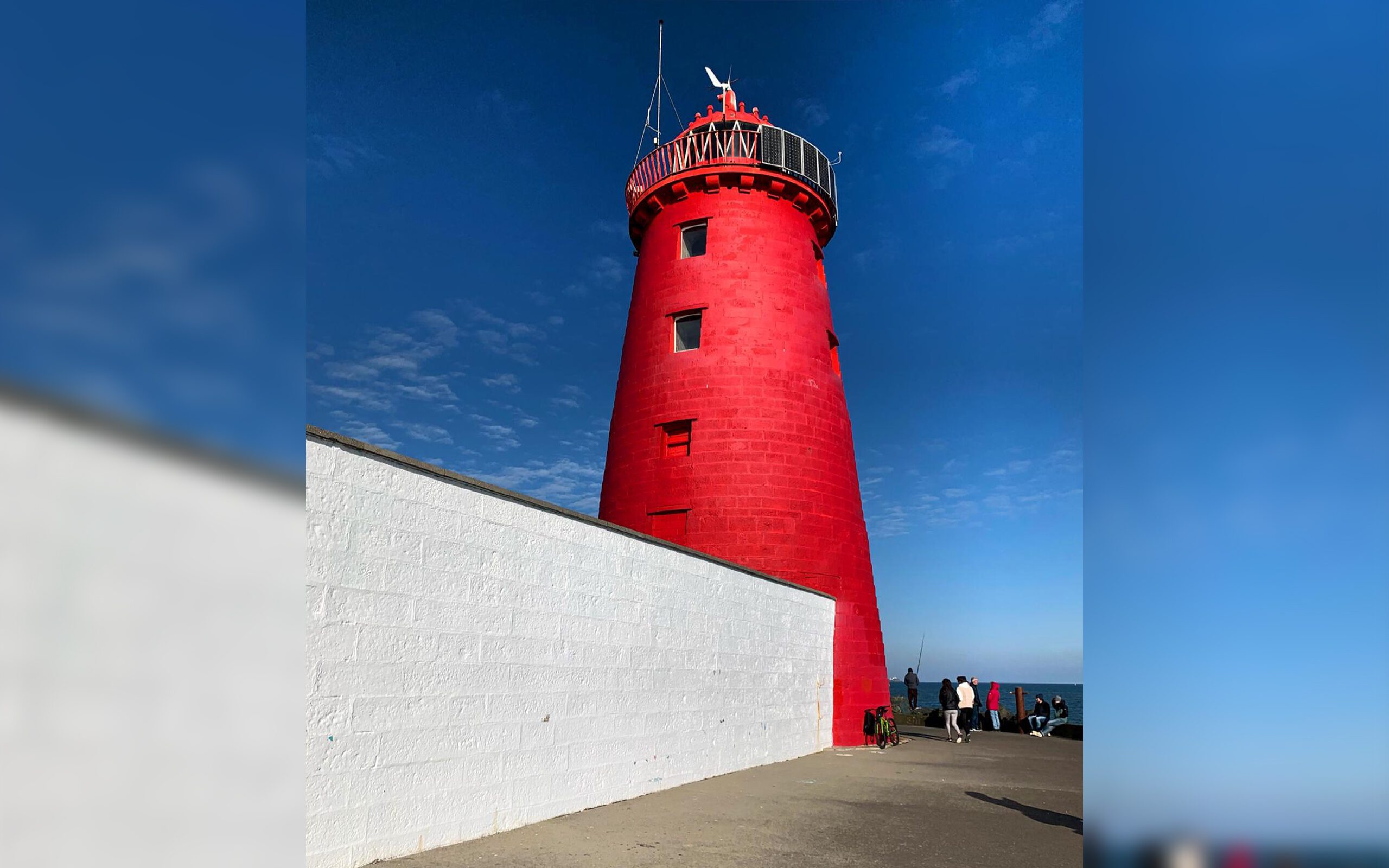 The Poolbeg Lighthouse located at the mouth of the River Liffey sitting on the Great South Wall, County Dublin. 